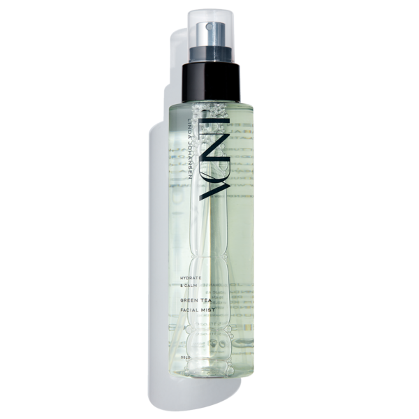 Green Tea Facial Mist with cork on a white background